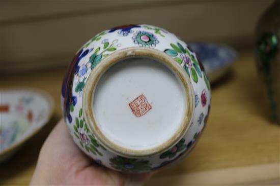 A Chinese enamel vase and two Chinese dishes